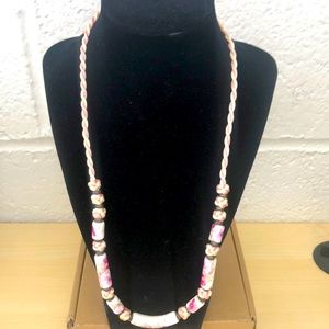 Vintage porcelain pink floral silk or nylon stranded necklace.